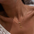 Close-up of a person wearing a dainty gold double layer necklace with starfish, shell, and pearl pendants.